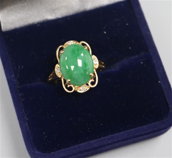 A 14ct gold jade and diamond set dress ring, size O.